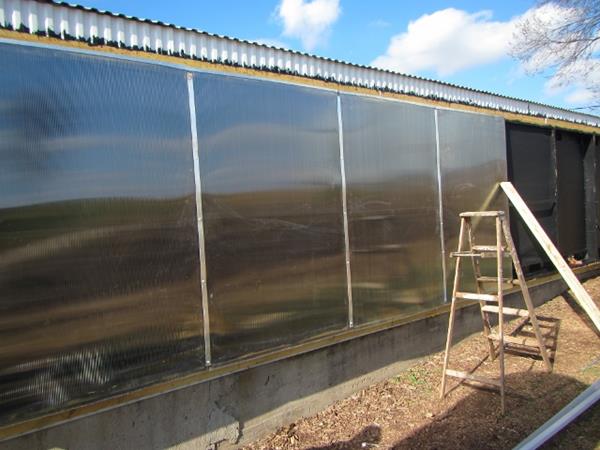 solar collector glazing being installed