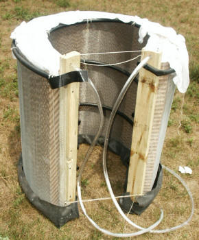 evap cooler pads surronding AC condenser coil